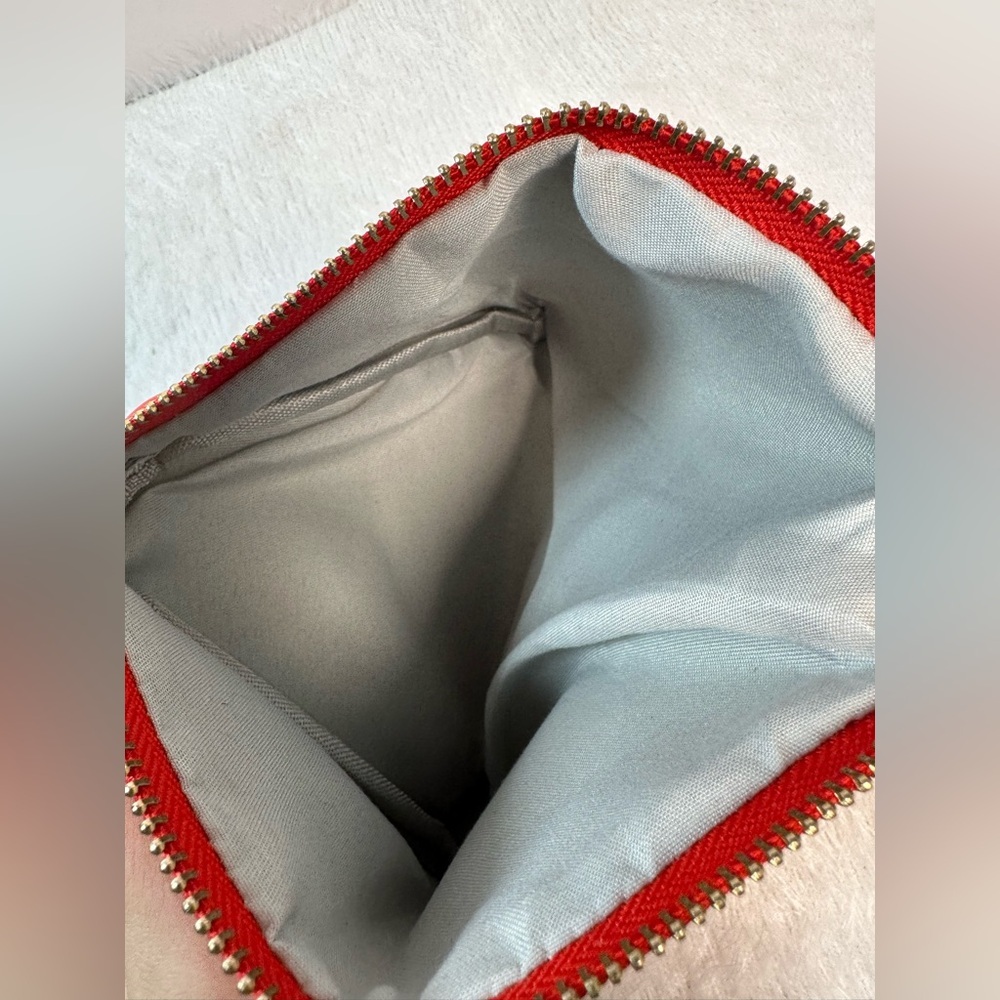 Bold Red Triangular Wristlet With Zipper Closure - image 6